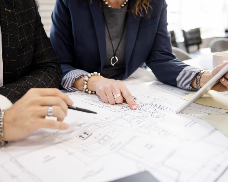 Calgary design professionals collaborating on kitchen renovation project plans and ideas.