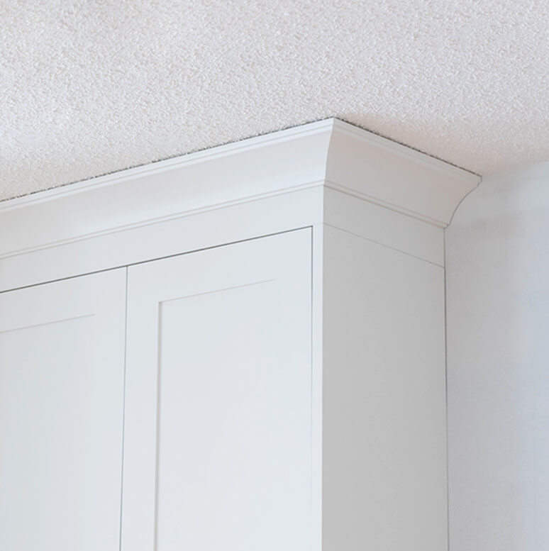 Elegant moldings and adornments for Calgary kitchen cabinets, enhancing home renovation aesthetics.