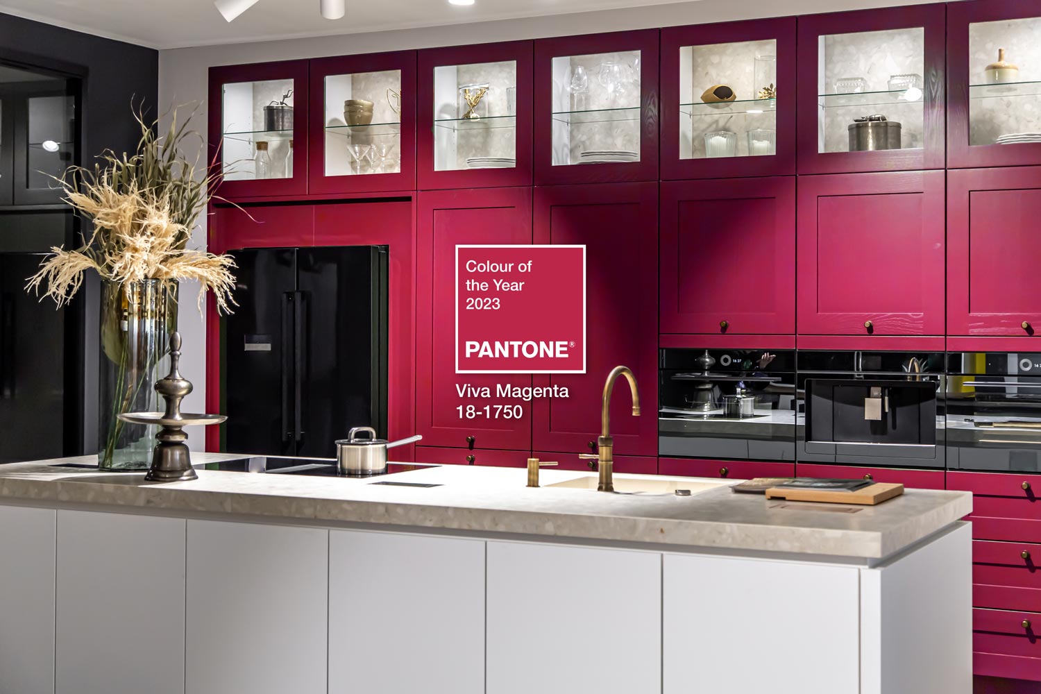 Calgary kitchen featuring vibrant Viva Magenta cabinets and countertops, showcasing Pantones Colour of 2023.