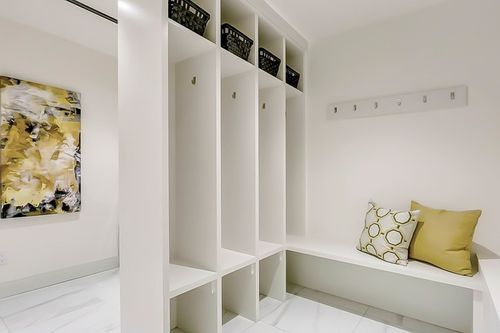 Modern mudroom with organized storage space.