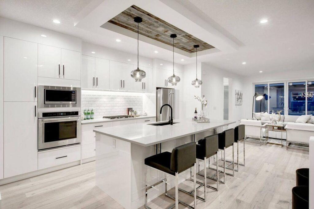 How to Modernize Your Kitchen: Low-Cost Renovation Tips 2 Sleek white kitchen with island.