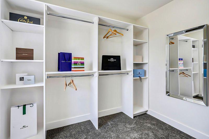 Minimalist closet with few items displayed.