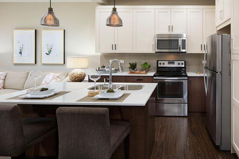 How to Finance a Kitchen Remodel: Smart Budgeting & Payment Planning 1 Modern kitchen with stainless appliances.