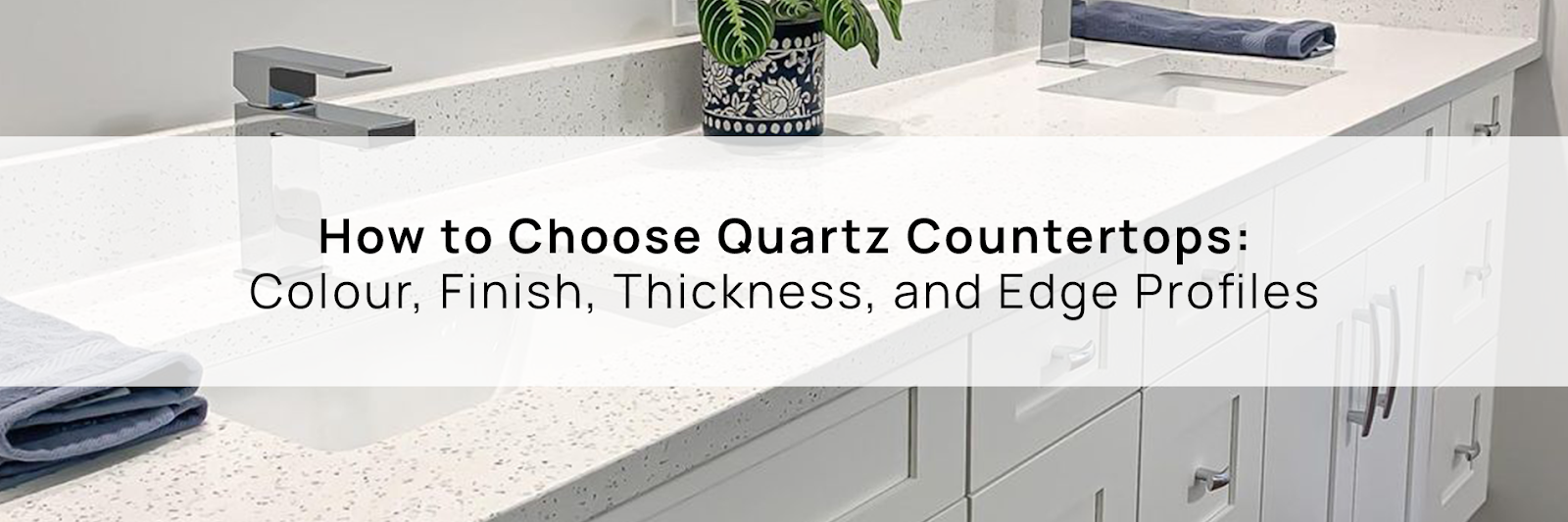 White bathroom vanity with a speckled quartz countertop, illustrating a material to consider when learning how to choose quartz countertops.