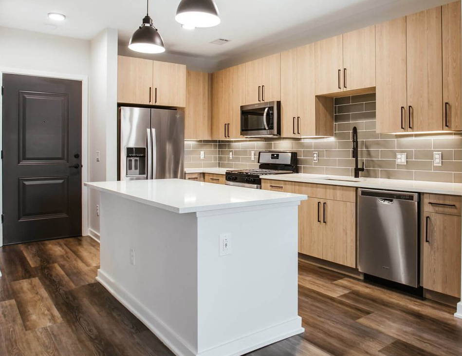 Luxury kitchen cabinetry and modern lighting; an example of professional manufacturing often subject to cabinet production lead times.