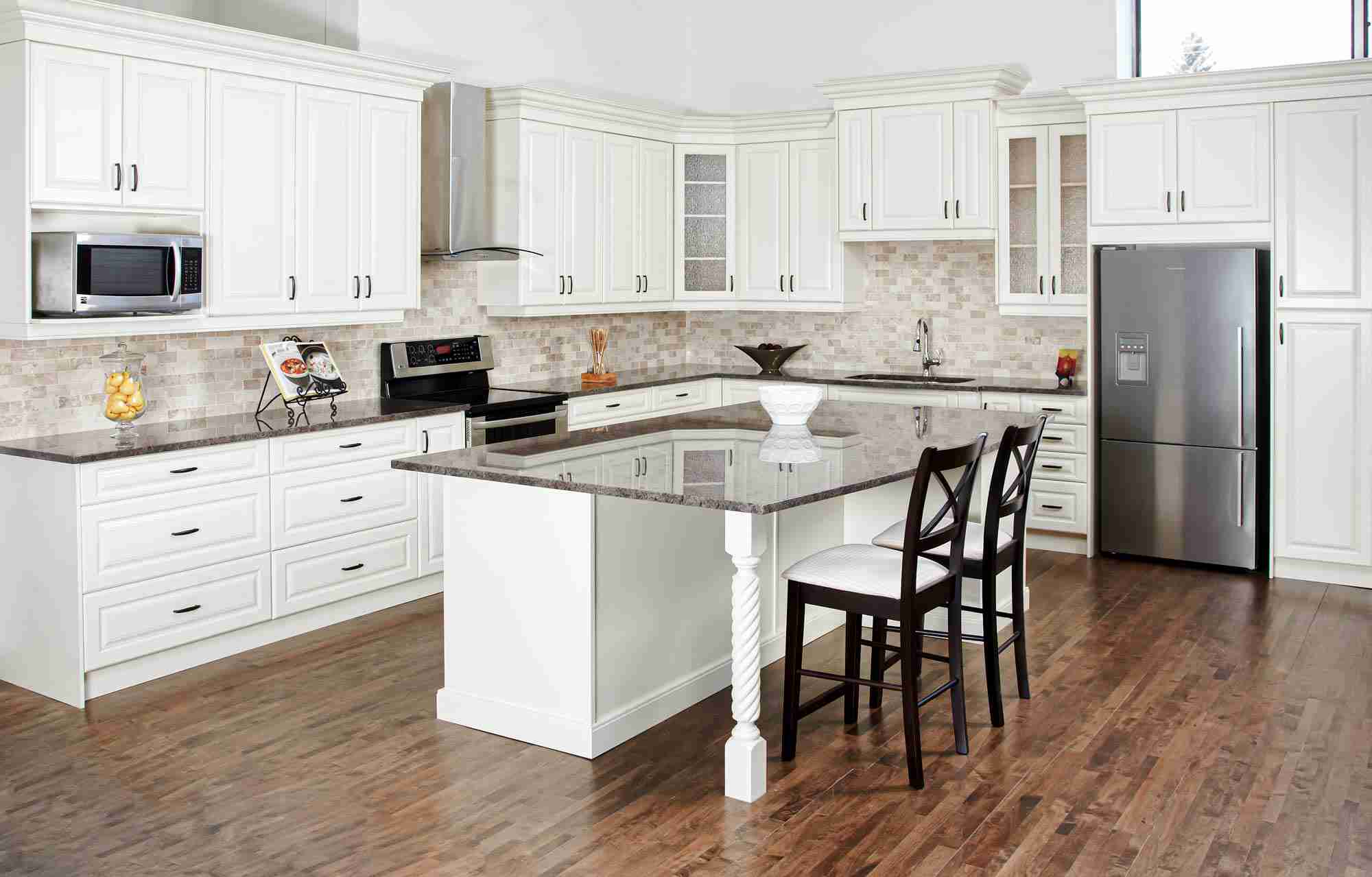 Kitchen featuring white cabinetry with standard placement for cabinet doors, allowing smooth opening, proper spacing between appliances, and balanced access to storage areas.