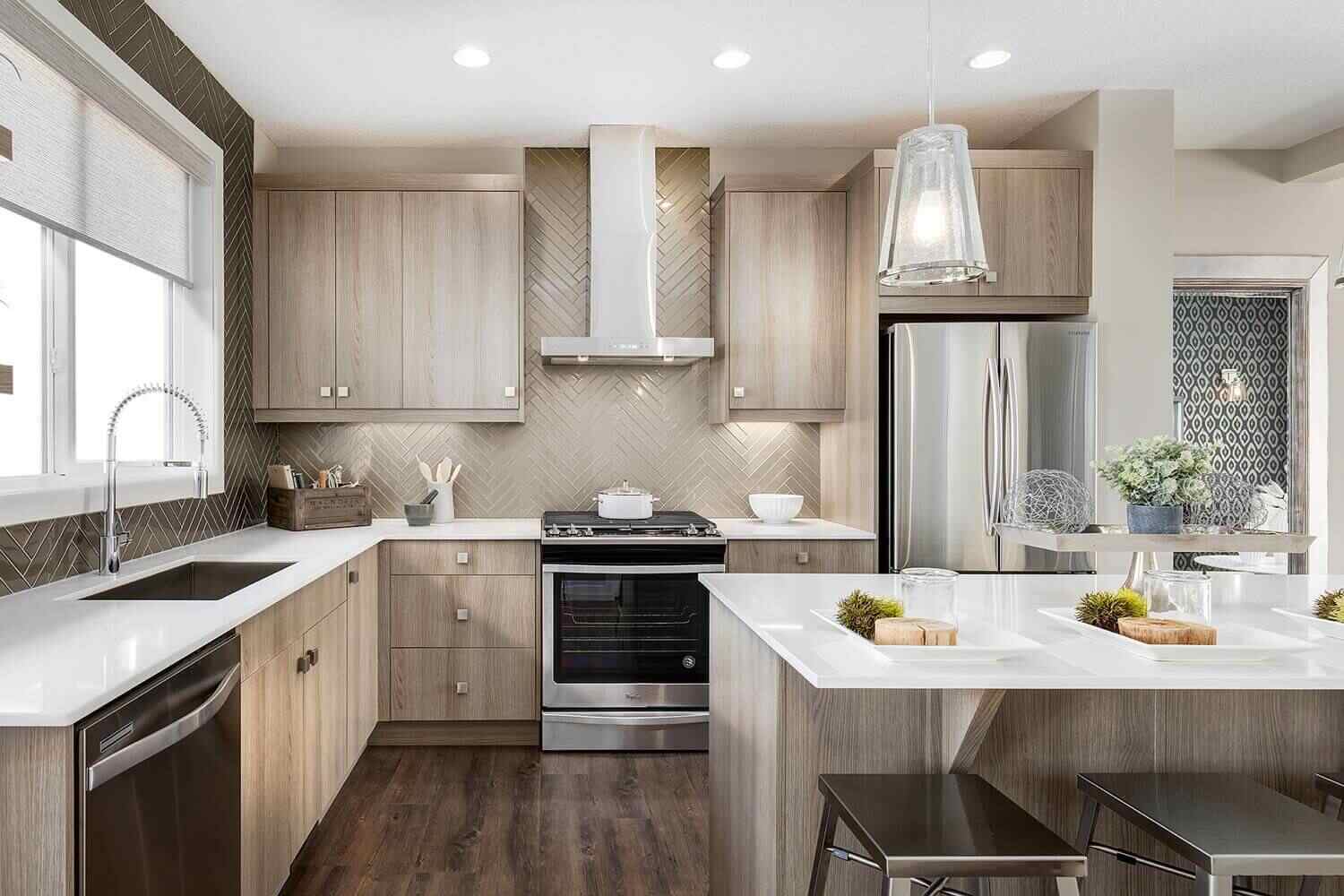Modern kitchen with light wood cabinetry, white countertops, and stainless steel appliances, showcasing options from refinish kitchen cabinets projects to full replacement for a complete kitchen transformation.