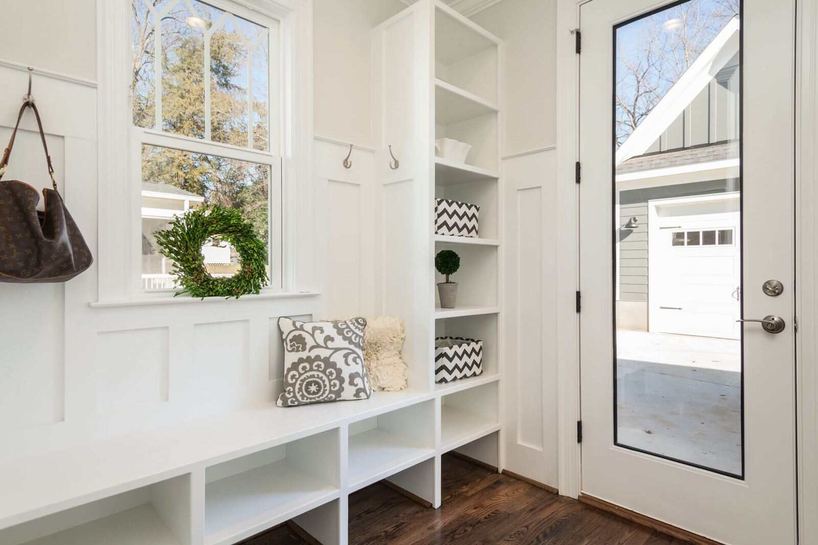 Built-in mudroom storage with bench, cubbies, and shelving, highlighting key areas to measure when planning a mudroom design.