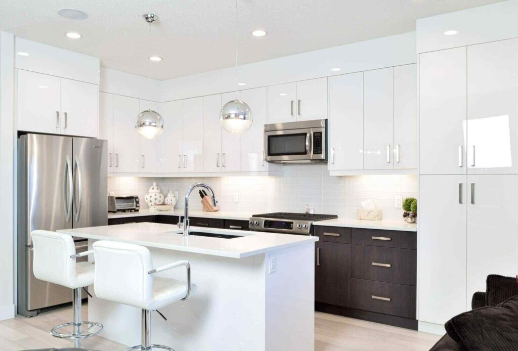How Much Are Kitchen Renovations in 2026? 1 Modern kitchen with white custom cabinetry, showcasing cabinetry scope, layout design, and customization options.