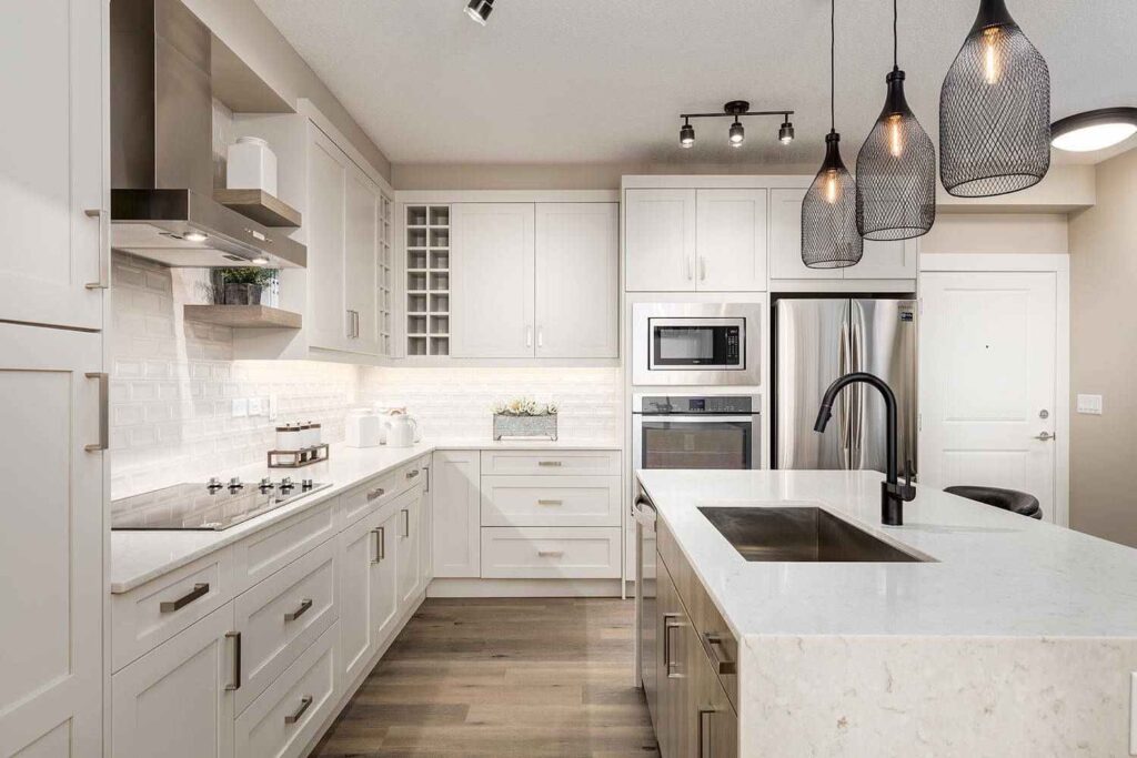 How Contractors Can Reduce Cabinet Installation Callbacks and Rework 1 Finished kitchen with professionally installed cabinets, countertops, appliances, and fixtures, highlighting what contractors should check before cabinet installation begins.